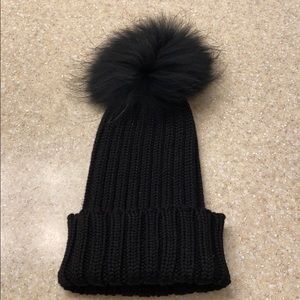 Black beanie with authentic mink pouf.